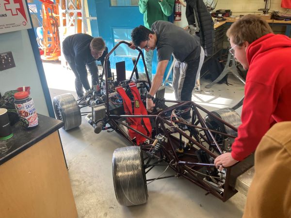 Pushing the car out of the shop for first day of testing