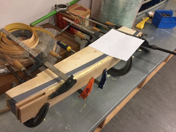 Hockey stick in clamps after a stressful glueup